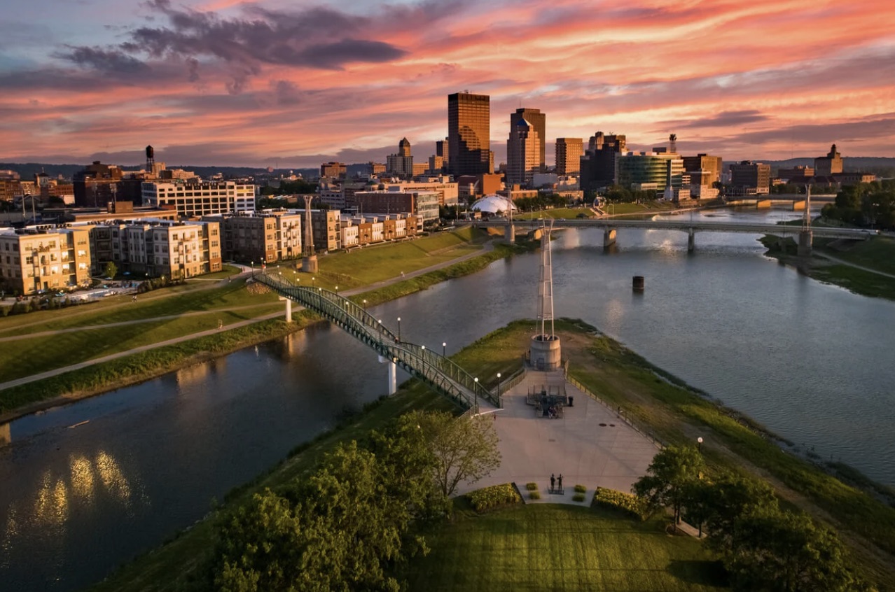 Dayton, Ohio skyline at sunset with riverfront and bridges